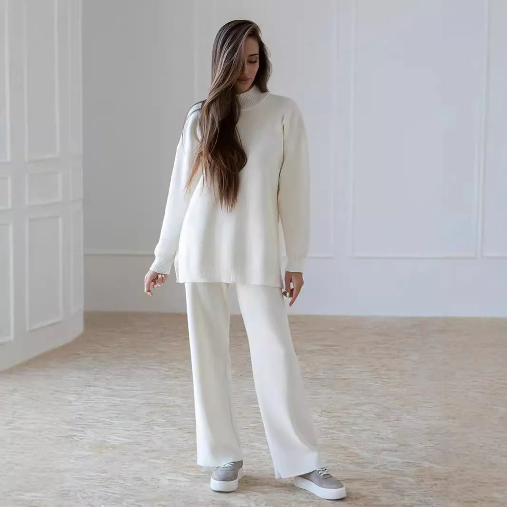 Women's turtleneck knit sweater suit set in solid colour with long sleeves and matching trousers on display