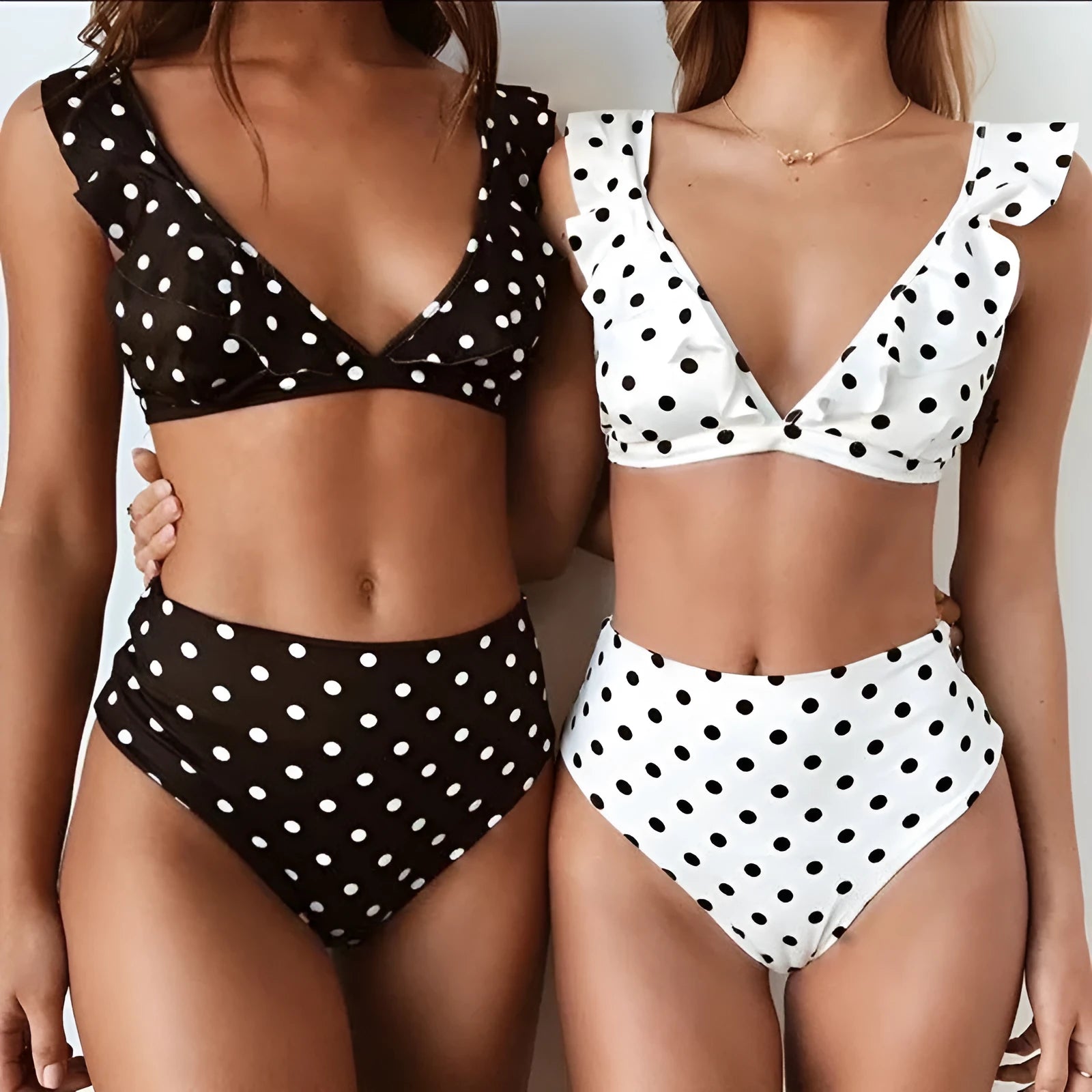 Women's black and white polka dot bikini set with ruffled V-neck top
