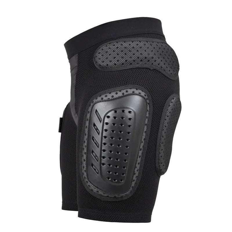 Black cycling hip protection pants showing integrated hip pad, displayed flat.