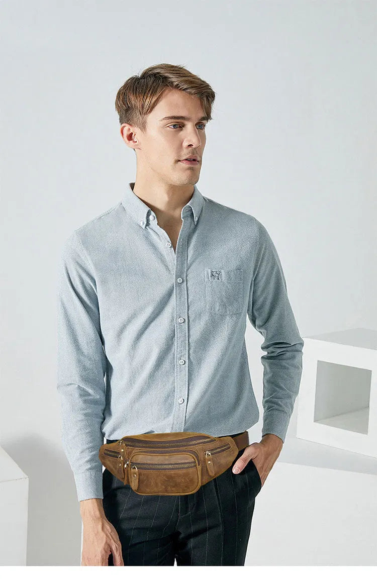 Brown leather shoulder messenger bag with a single strap and top flap closure.