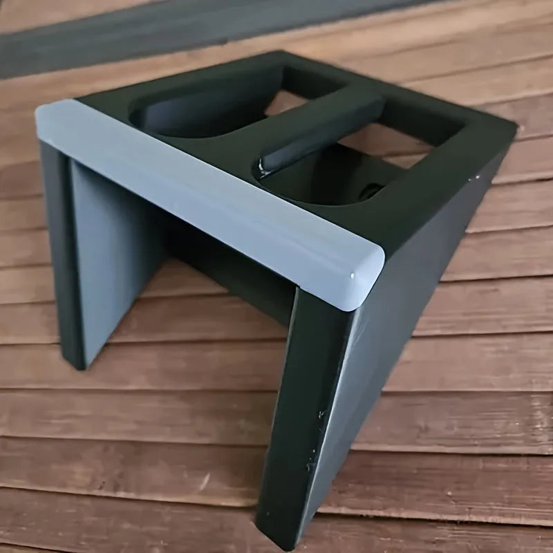 Black plastic punk-style pistol stand for displaying replica firearms.