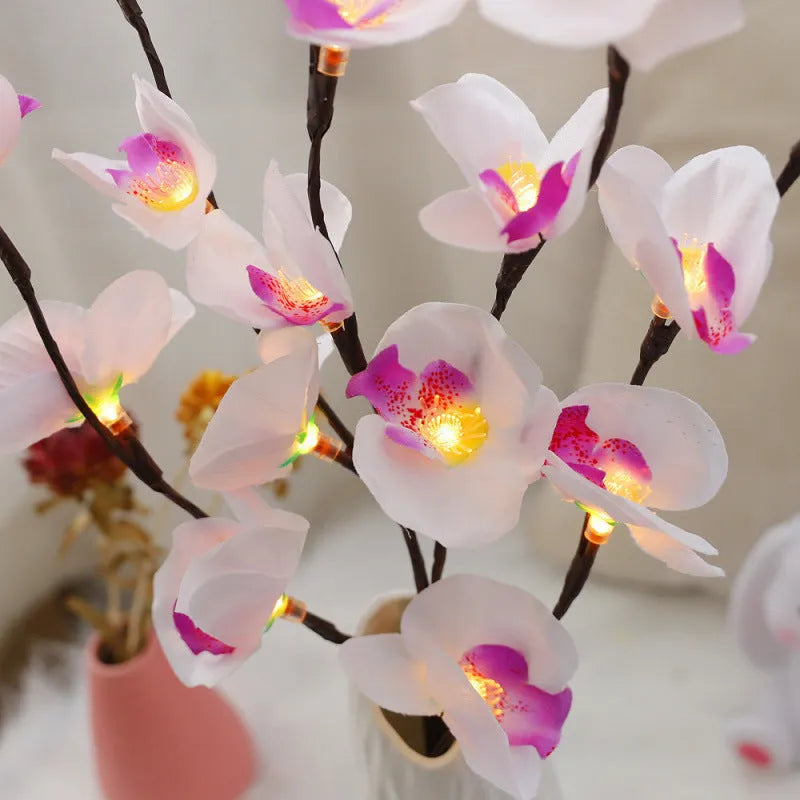Pink fabric phalaenopsis flower on a 65 cm plastic LED branch light for bedroom decor.