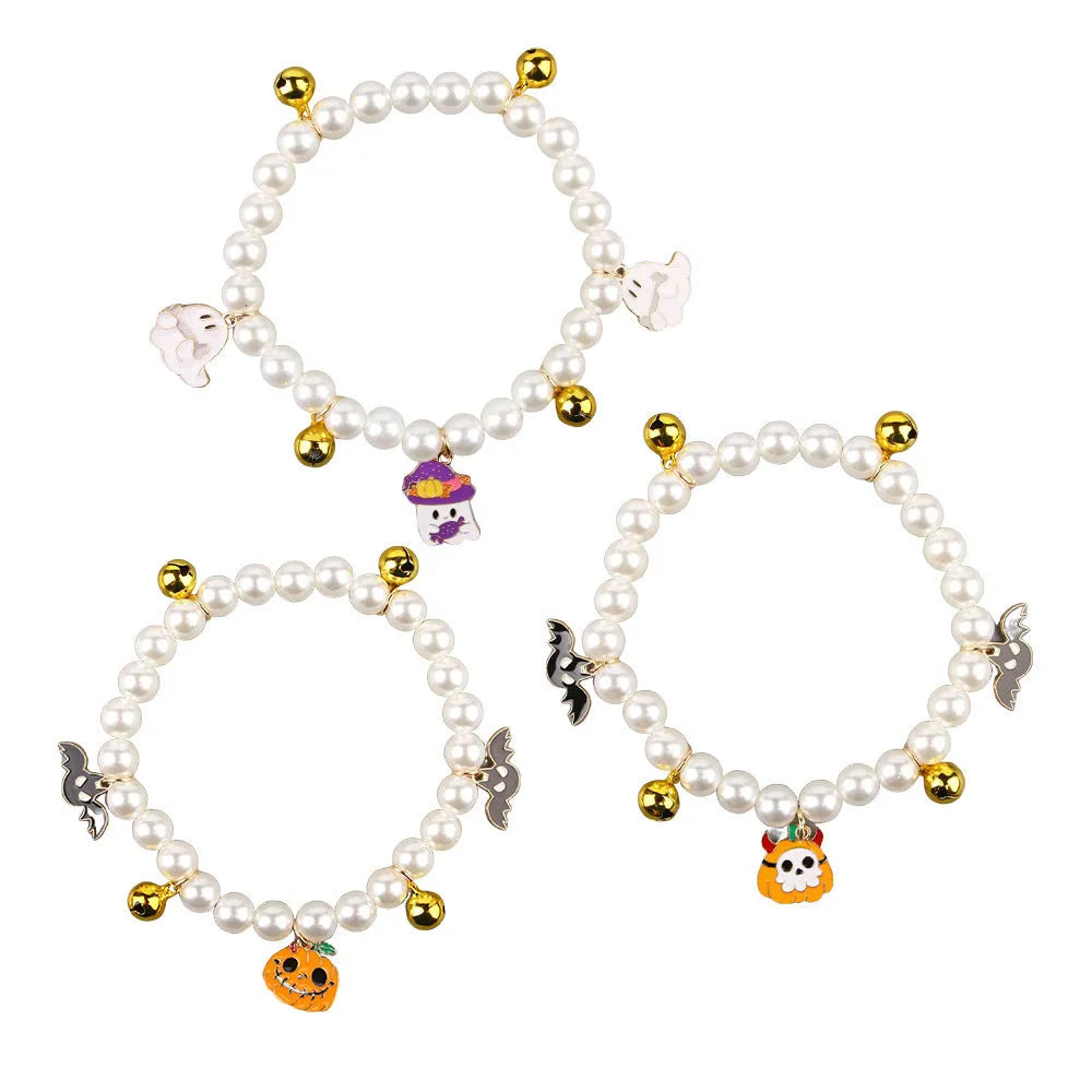 Halloween decorative pet collar with simulated pearls and a choice of pumpkin-themed charms: purple ghost, skull, or smiling.
