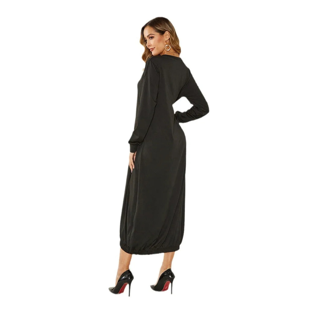 Black long lantern dress with lace-up crew neck and loose knit fit, shown on a model.