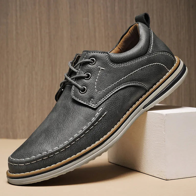 Men's black genuine leather lace-up casual shoes with round toe and stitched sole