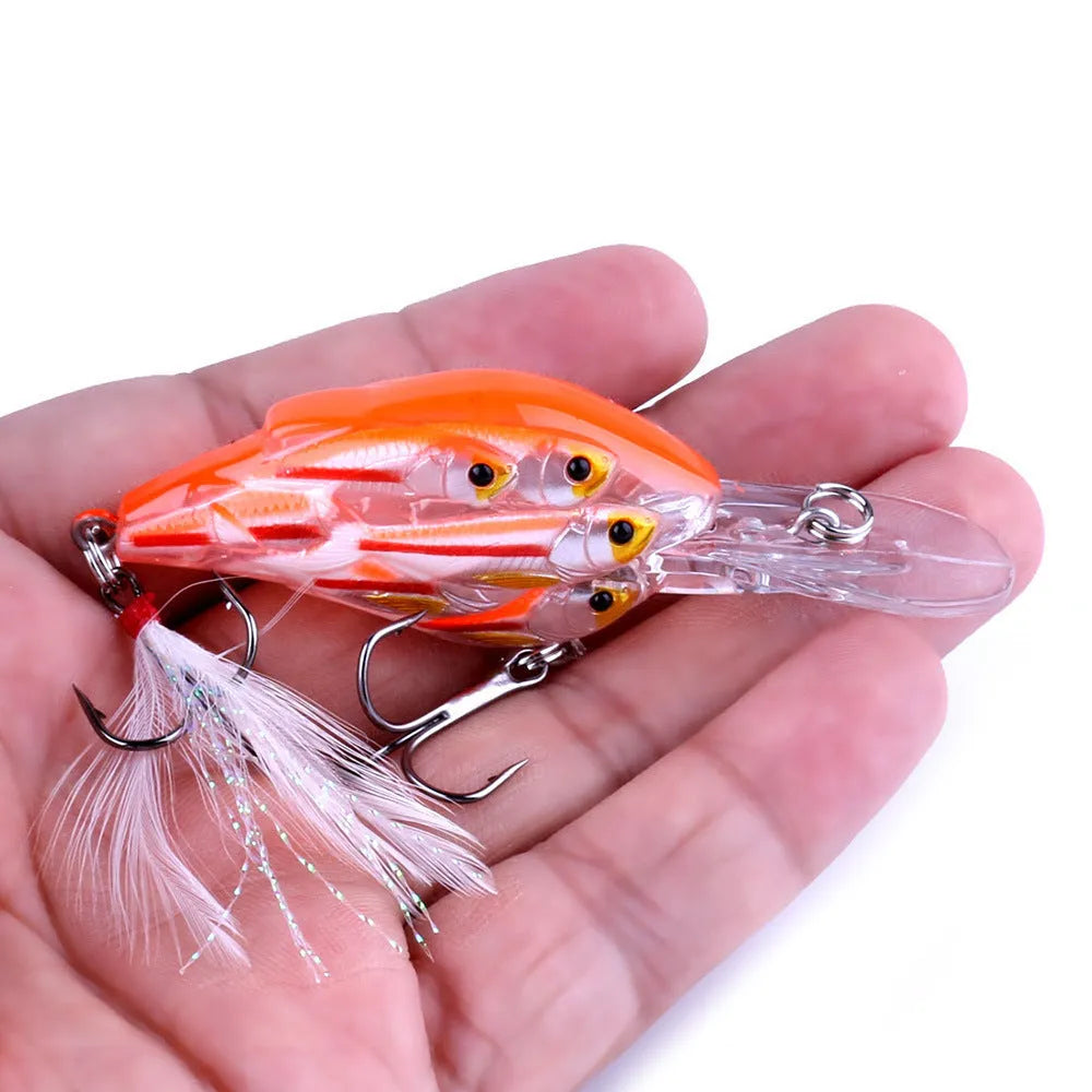 Sea fishing hard bait lure with feather hooks floating on water surface