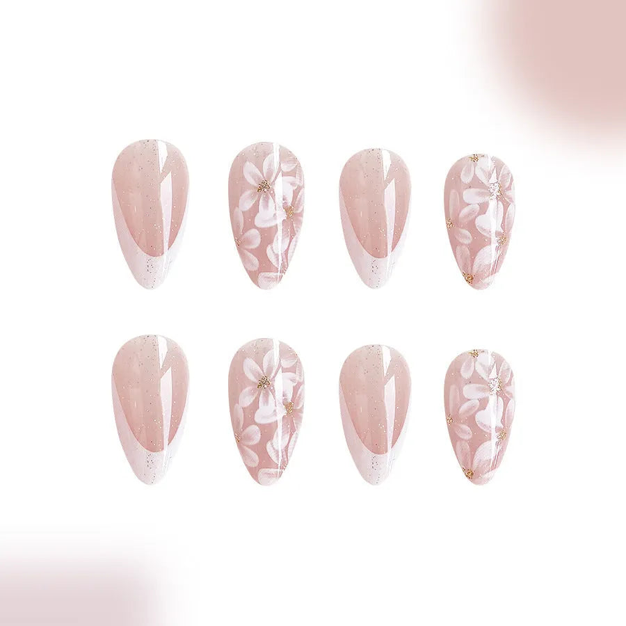 Short almond shaped French style false nails with glitter and floral patterns C625 colour