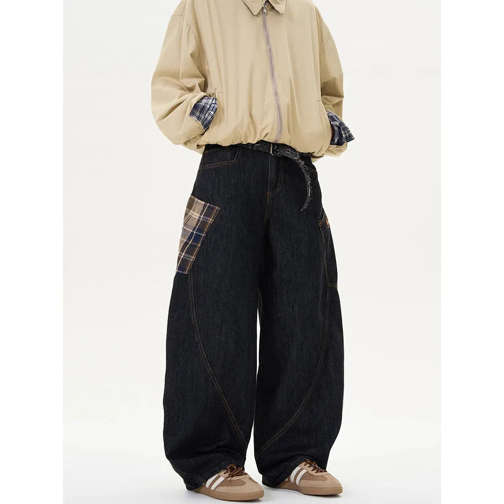 Man wearing loose straight-leg casual trousers in a red plaid pattern.