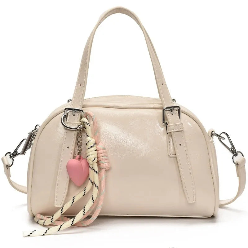 Korean-style women's shell shoulder bag in square shape with optional pendant attachment