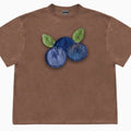 Blueberry and floral patchwork pattern on a loose-fit short sleeve round neck t-shirt.
