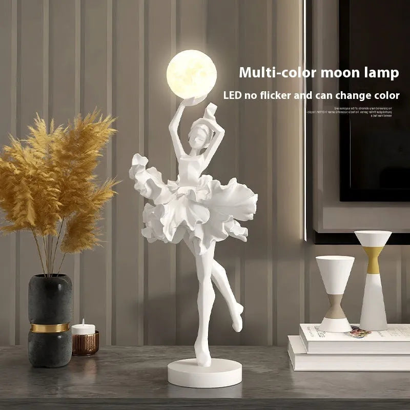 Small modern night lamp ornament in resin showing colour options: black gold, white, pink, and light blue.