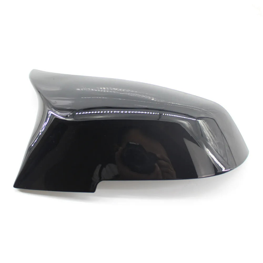 Pair of paint bright black horn-style BMW rearview mirror shells for F30 3 Series.