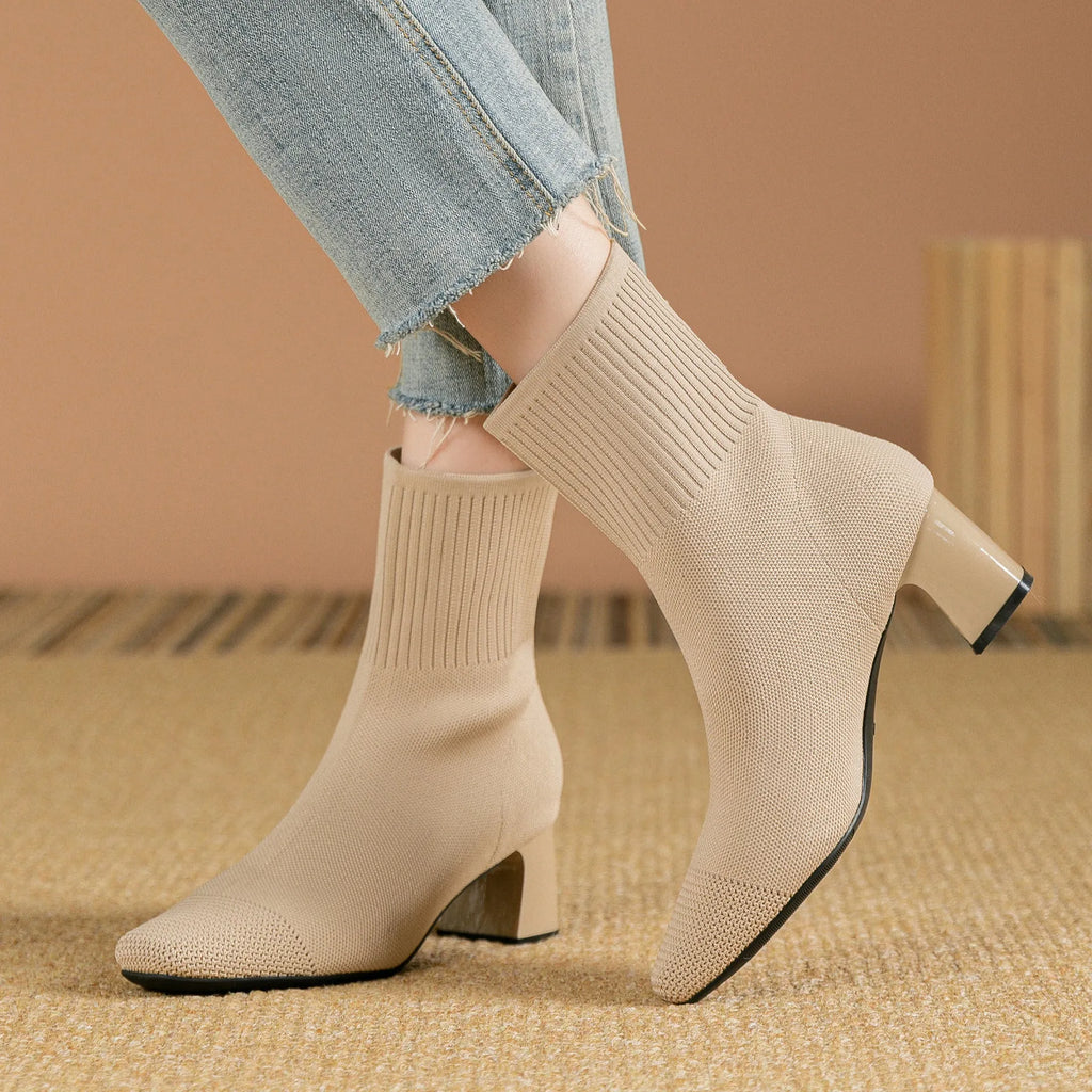 Women's knitted sock boots with chunky high heel, square toe, mid-calf length, rubber sole, available in multiple colours