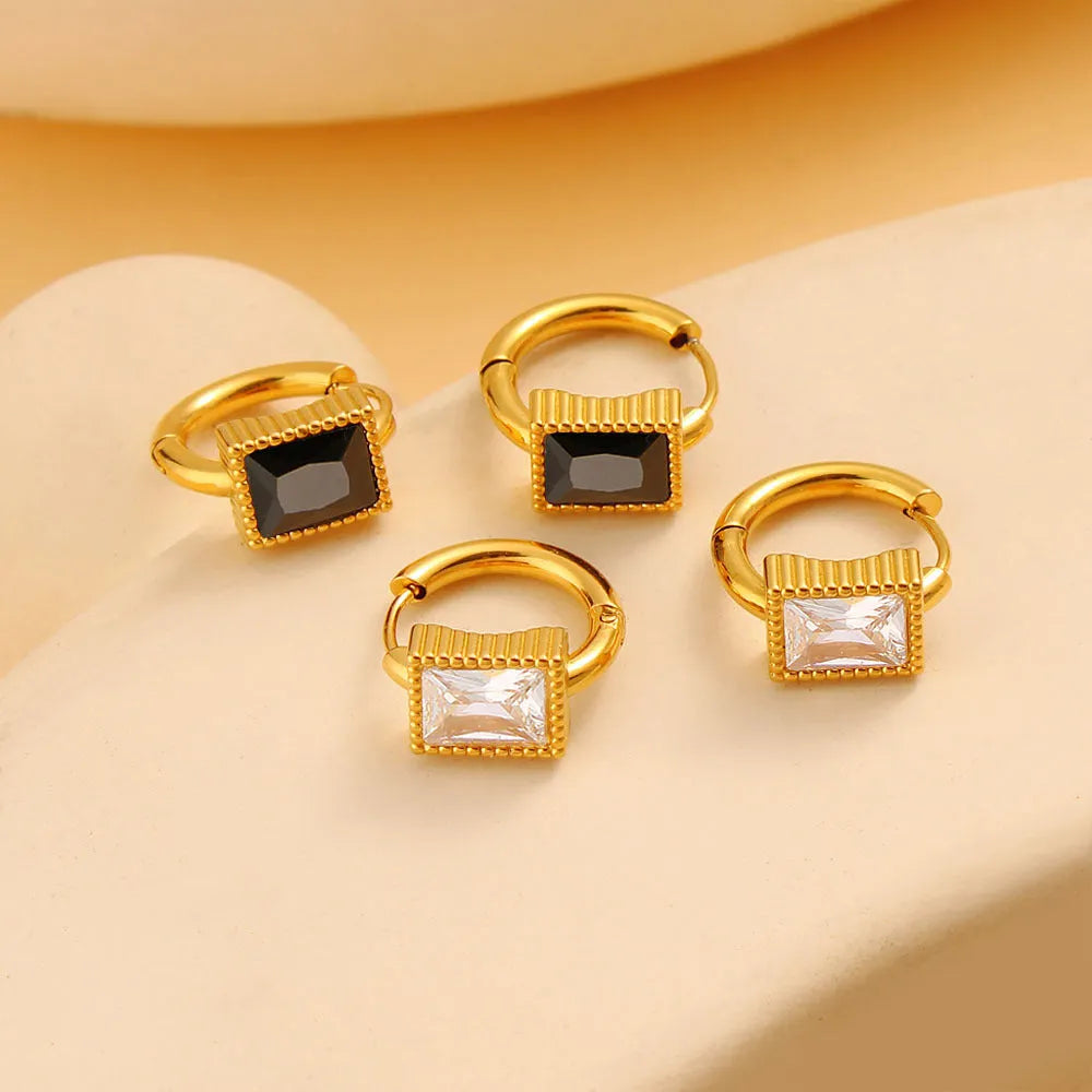 Square zircon stainless steel earrings in geometry design with round ring details, shown in white colour.