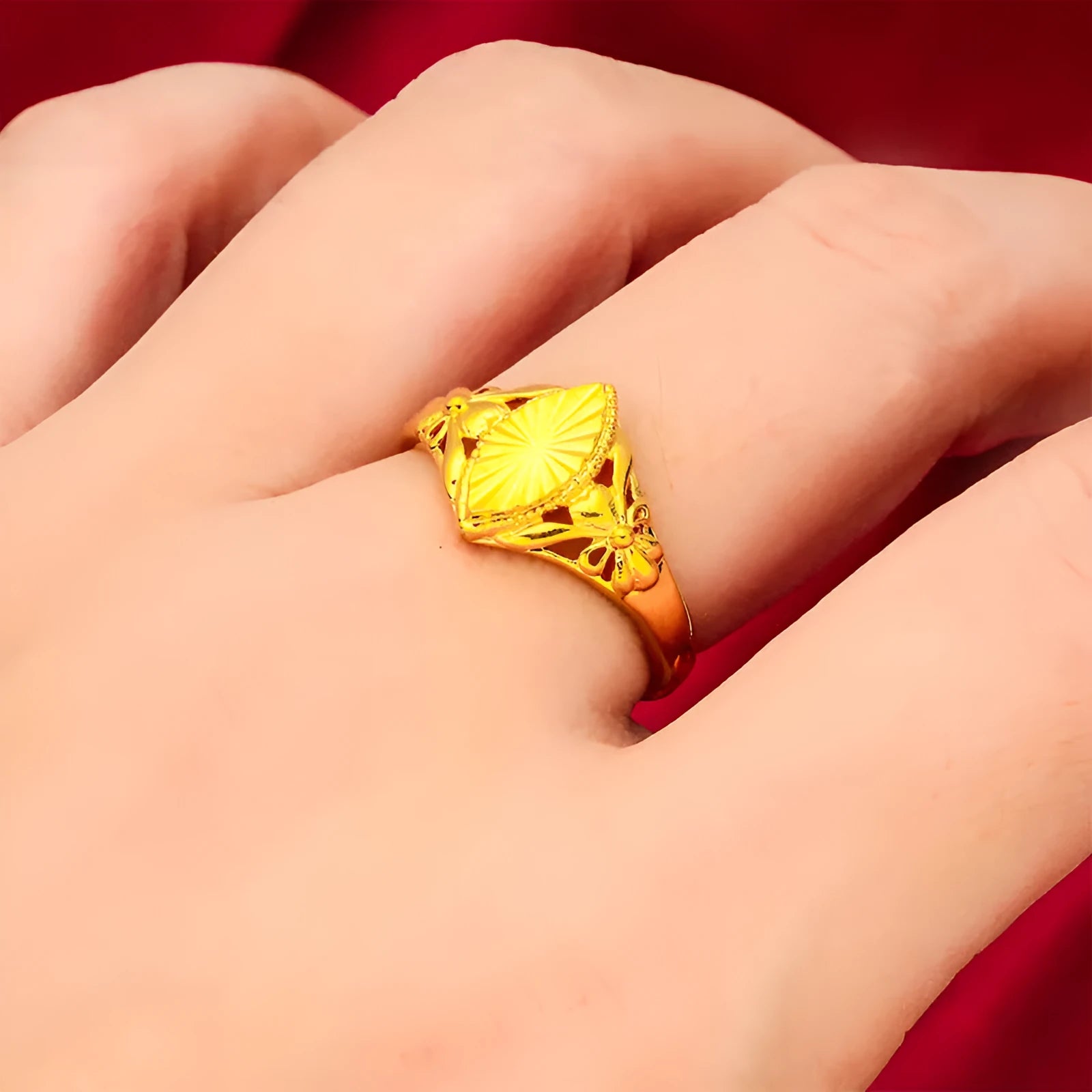 Gold-coloured brass ring with geometric open diamond flower pattern and textured surface