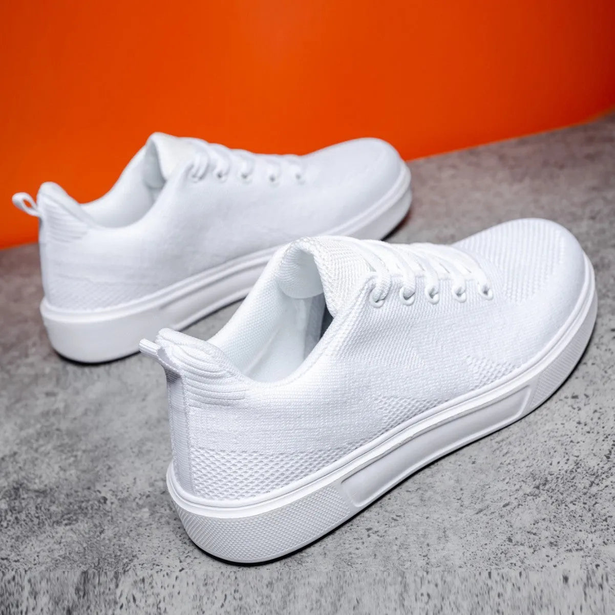 Light white casual board shoes with mesh upper, thick flat EVA sole, and round toe in black and white colour options.