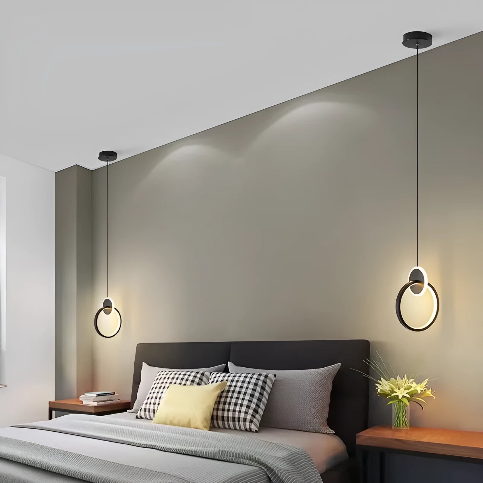 Modern black double ring Nordic pendant lamp hanging from ceiling with adjustable cable.