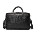Black top grain cowhide leather men's briefcase showing its horizontal square shape and internal organiser pockets.