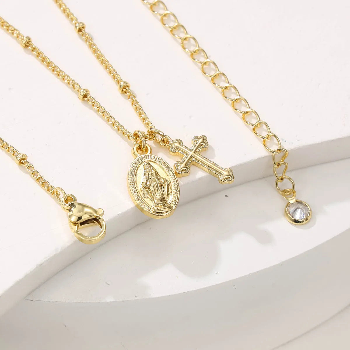 Gold geometric Virgin Mary cross necklace pendant on chain