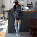 Women's creamy-white knitted suit set with geometric pattern jumper and elastic waist shorts