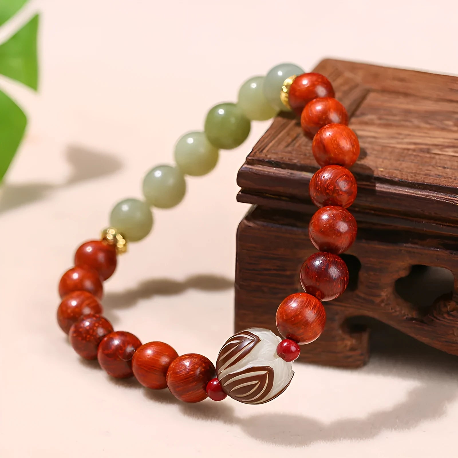 Red rosewood and grey jade Chinese style bracelet with Bodhi lotus design, showing 8mm and 12mm beads