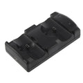 Black PS3 dual controller charging station with two wireless gamepads docked upright