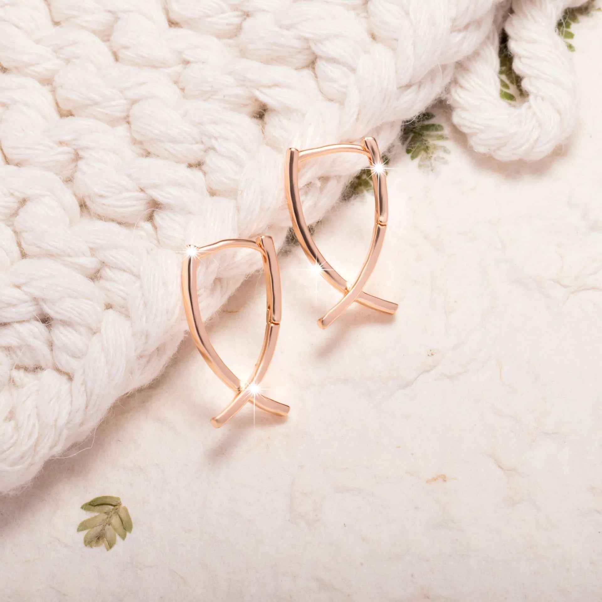 Rose gold cross shaped earrings on a copper base, light luxury style