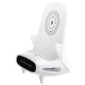 White mini chair shaped wireless charging stand holding smartphone with cable connection