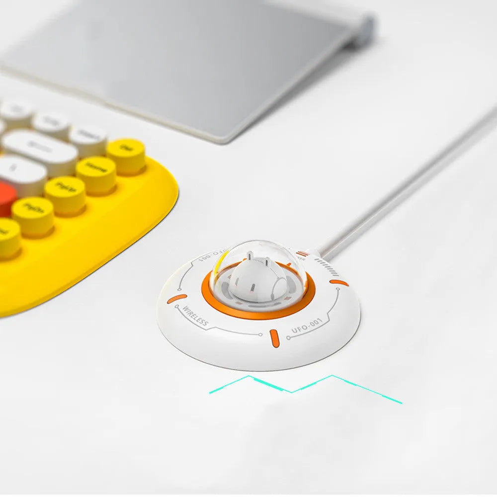 White wireless charger with magnetic MagSafe alignment and charging indicator light on a desk
