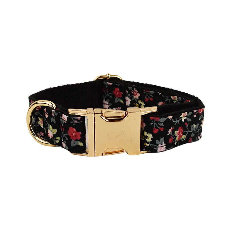Dog wearing four-piece cloth accessory set with collar, leash, vest, and removable bow with lettering print