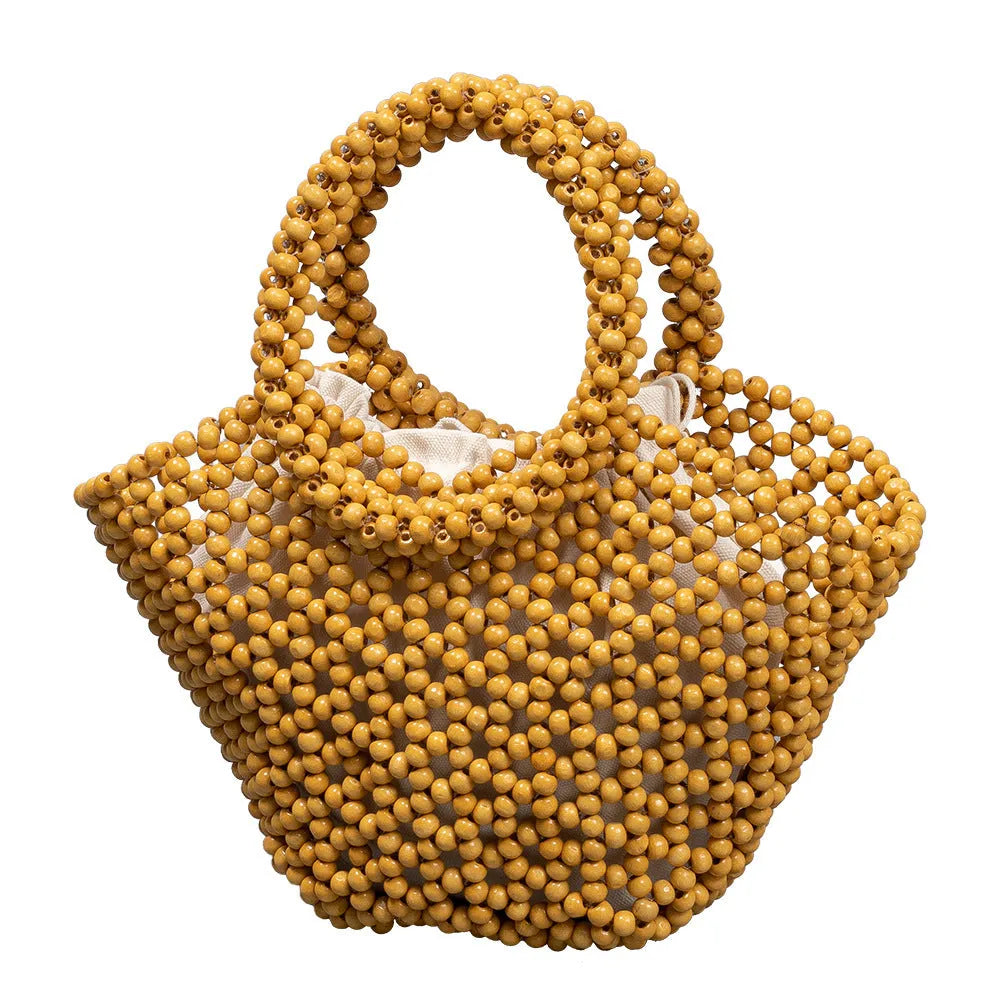 Hand-woven maple beach bag with wooden bead decoration showing hollow dumpling design