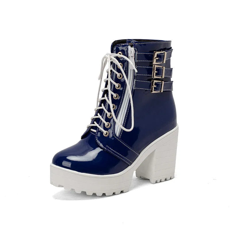Women's black thick-heel ankle boots with lace-up front and round toe on a rubber sole.