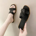 Women's solid-colour cross-strap PVC sandals with a toe-ring design on a non-slip sole.