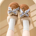 Women's beige suede half slippers with a ribbon bow and thick EVA sole.