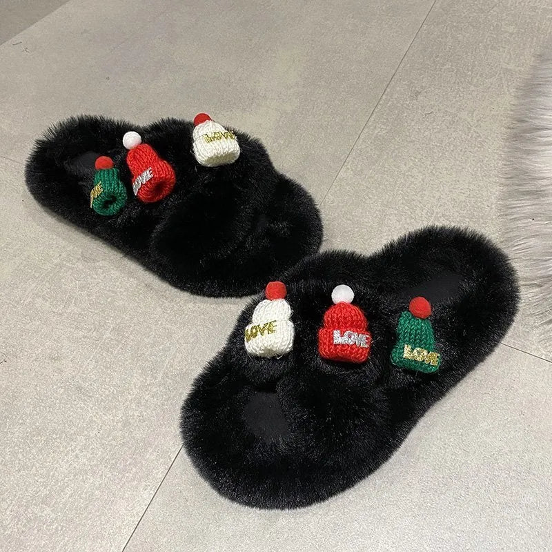 Women's Christmas hat slippers with hairy faux plush upper on a rubber sole.