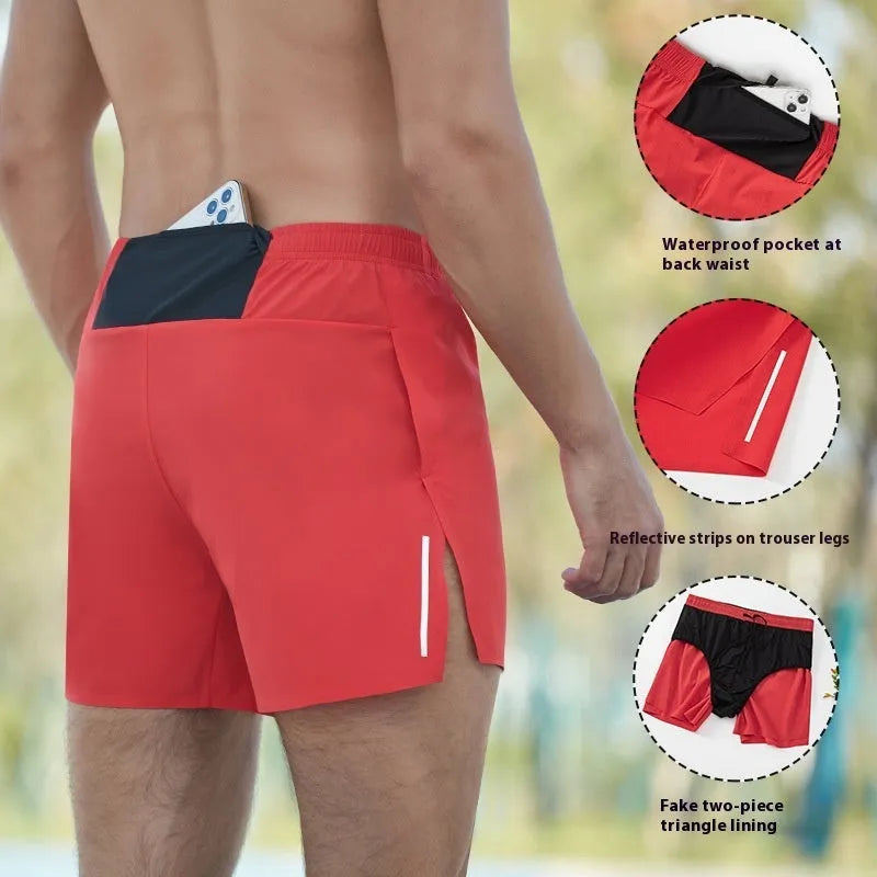 Man wearing high-waisted, loose-fit black off-road running shorts for marathon training.