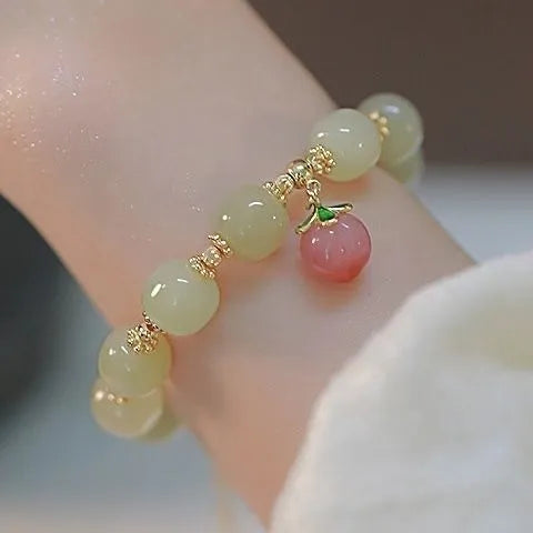 National style glass bracelet with rabbit charm and coloured glaze decoration