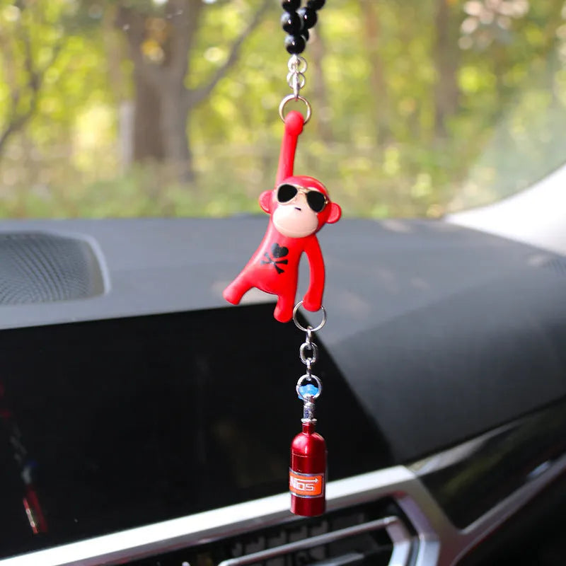 Cartoon monkey wearing sunglasses rearview mirror pendant on a bead necklace.