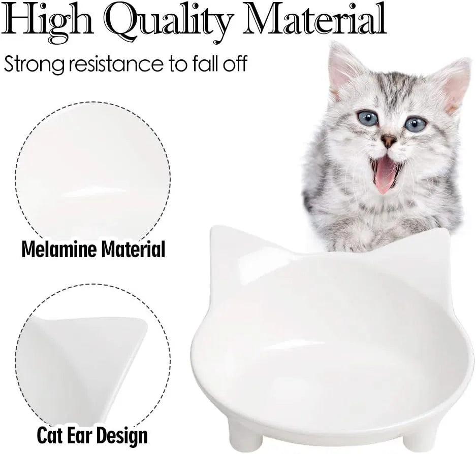 A shallow black melamine pet bowl with a non-slip rubber base on a kitchen surface.