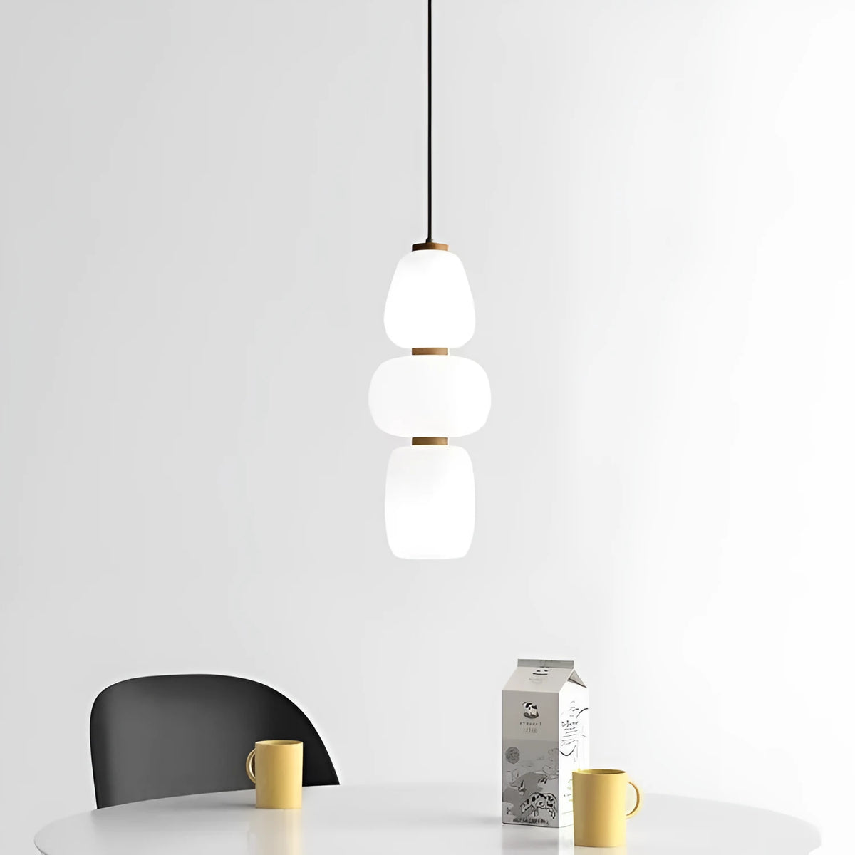 Modern minimalist long chandelier with iron frame and glass elements emitting warm LED light in a living room