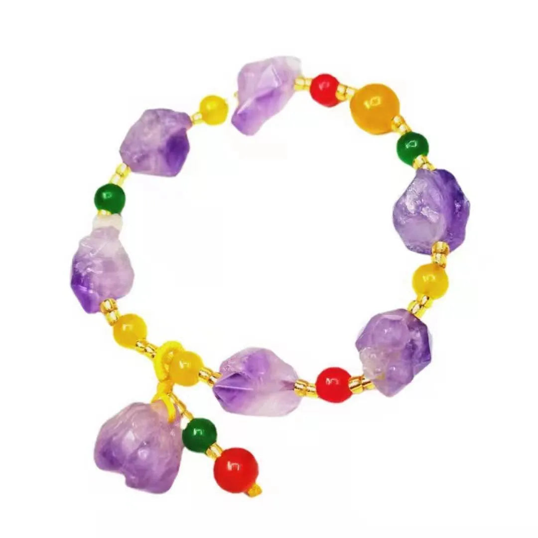 Purple natural shaped amethyst bead bracelet for women with a fu character charm.