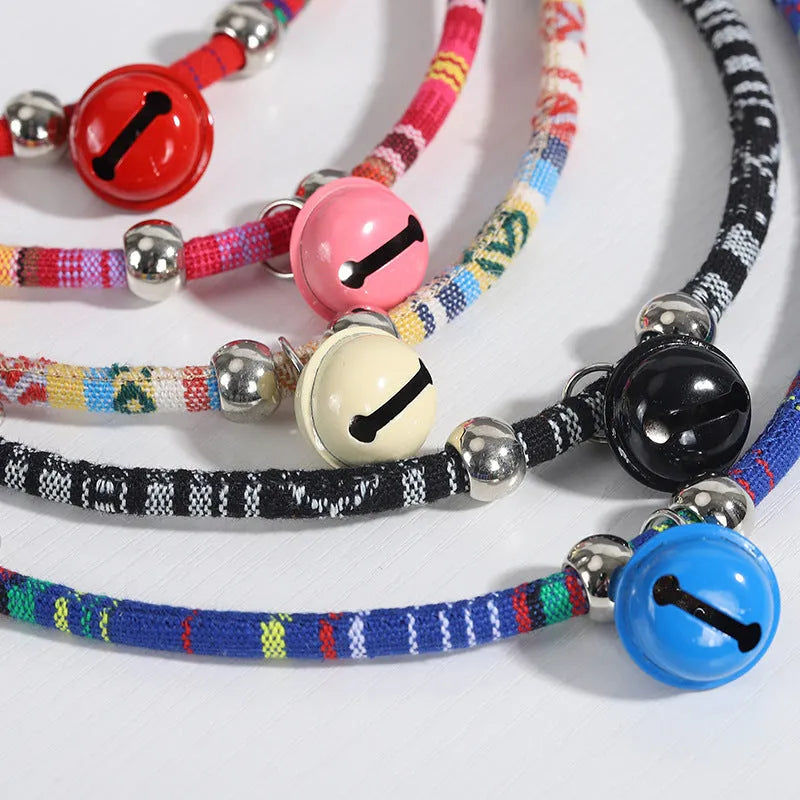 Coloured adjustable pet collar with a metal bell and buckle in ethnic style for dogs and cats.
