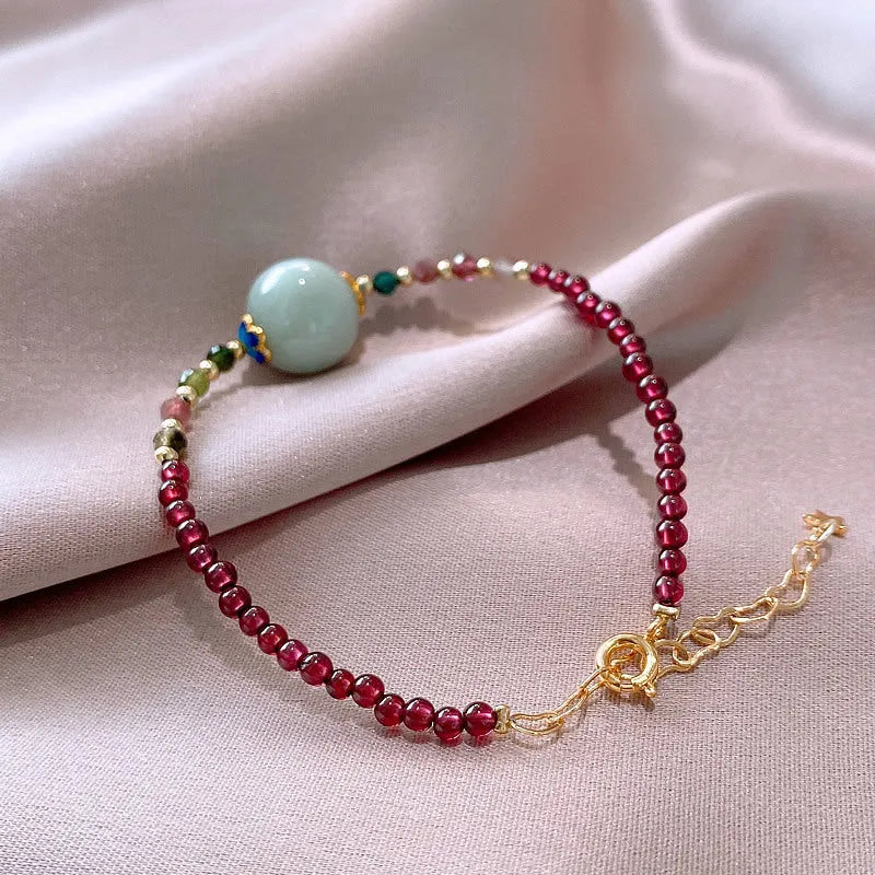 Women's Chinese style bracelet with garnet colour, drop-shaped tourmaline stones and electroplated finish