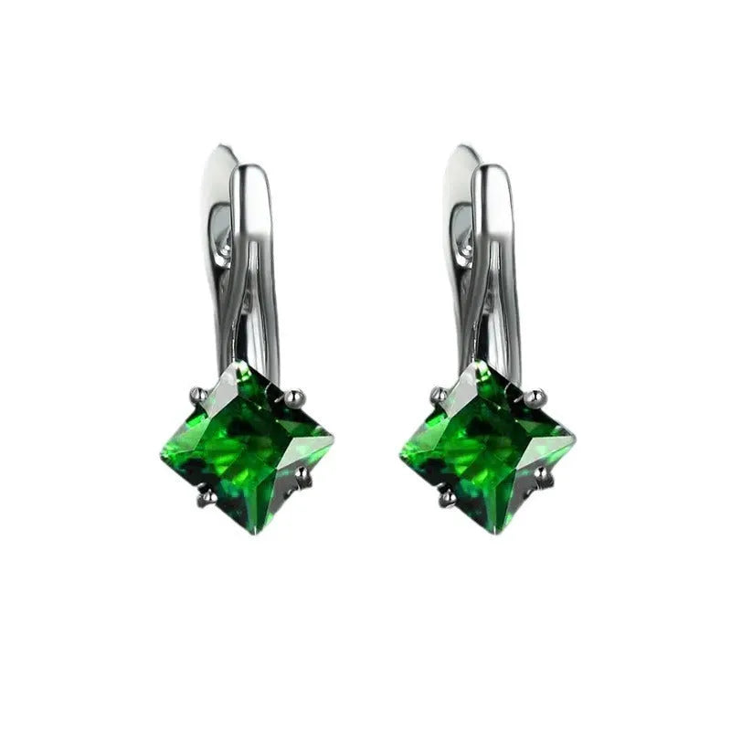 A pair of women's copper earrings with a diamond design featuring inlaid blue zircon stones.