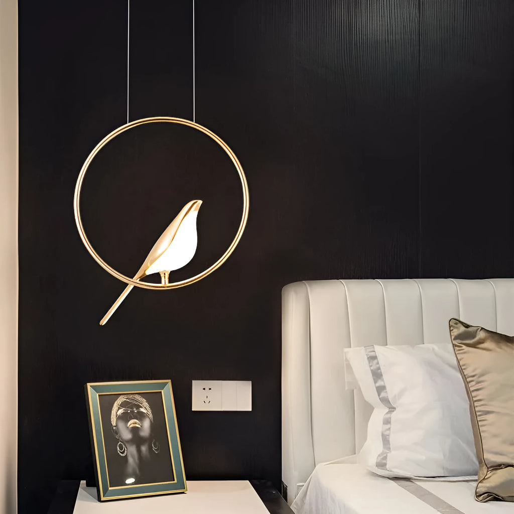 Minimalist clear acrylic magpie bird chandelier ceiling light with a metallic frame.