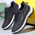 Black and grey low-top waterproof casual shoes with a lace-up front and plastic sole.