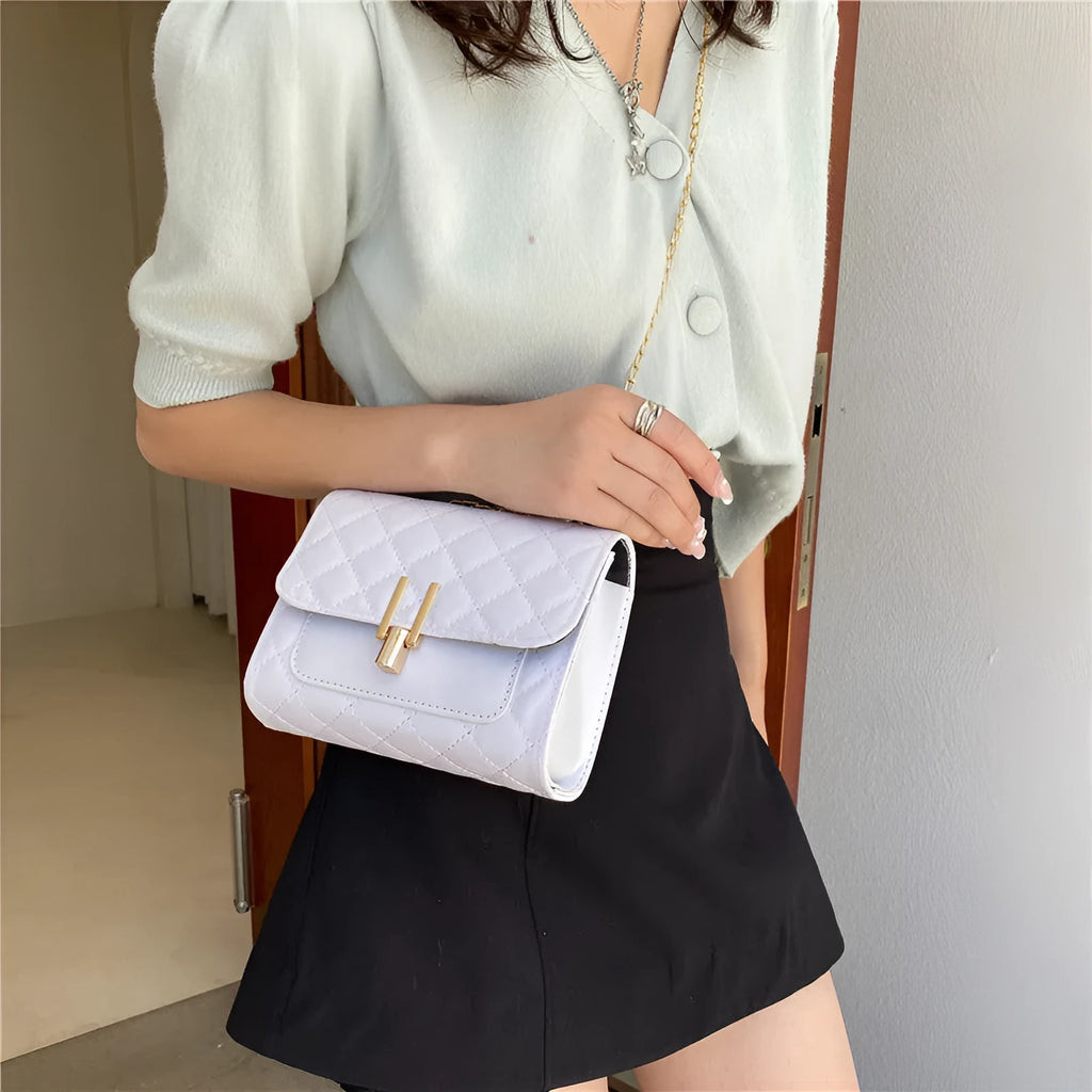 Women's crossbody bag with diamond lattice chain design in PU leather showing black colour option