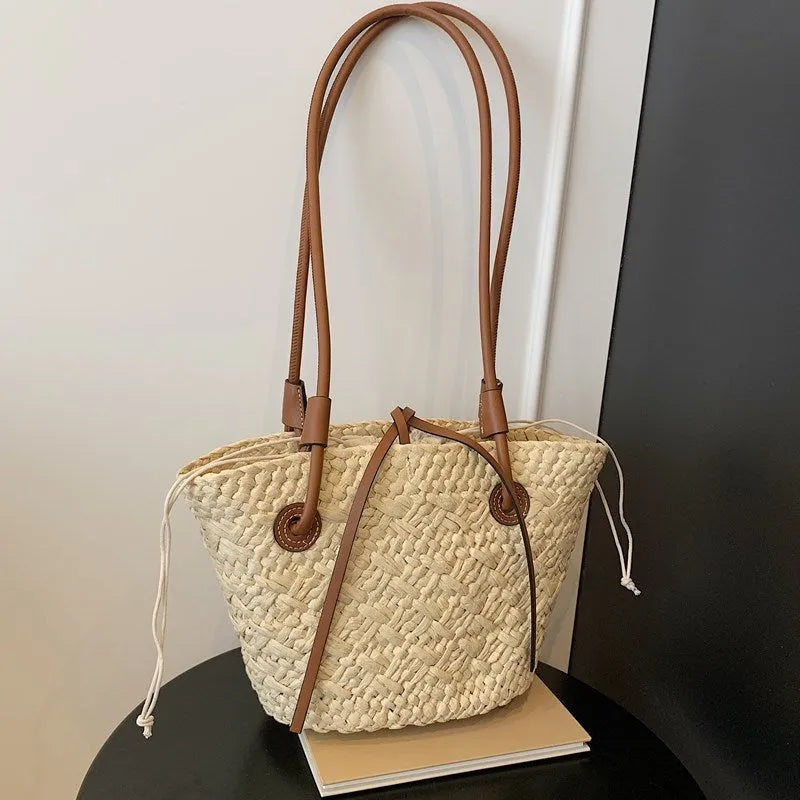 Retro style woven shoulder and hand bag in khaki colour with horizontal square design