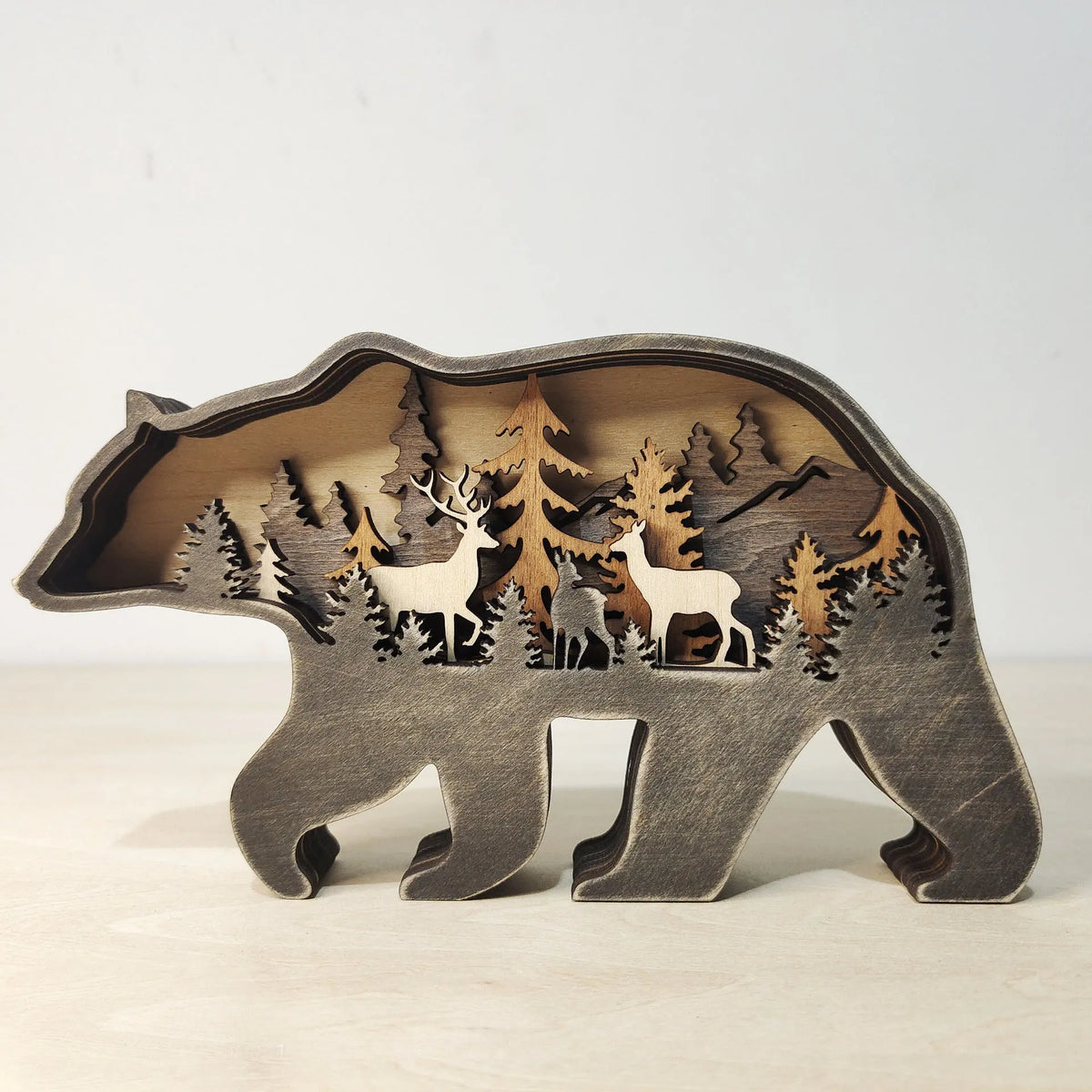 Boxwood Christmas elk ornament 18cm tall with natural wood grain on a wooden shelf