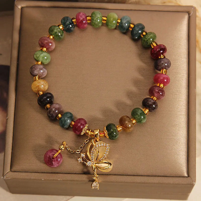 Colourful tourmaline bead and butterfly charm on women's alloy bracelet